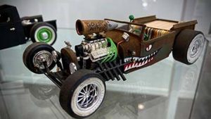 A picture of a model car with shark detailing